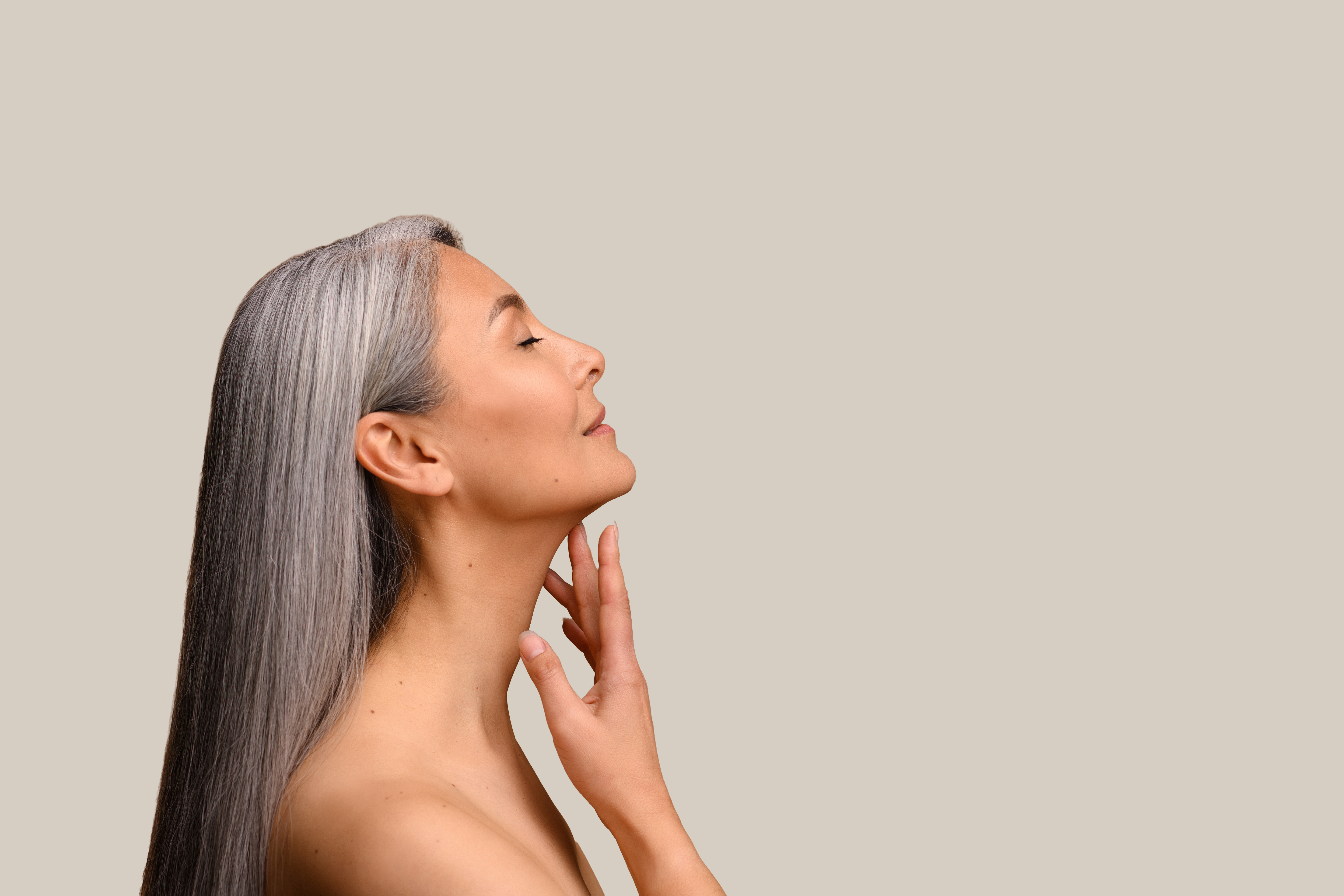 Skin Physics neck firming serum applied to decolletage Australia